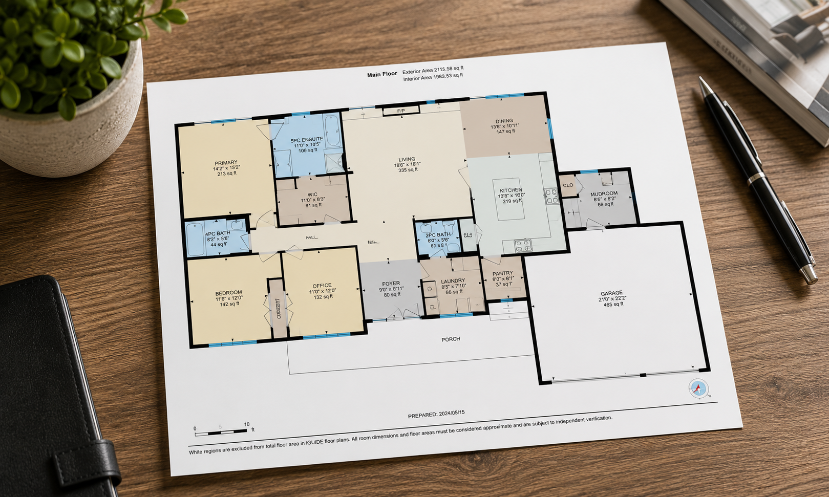 Home office desk setup with floor plan overlay, photographed by Visaro